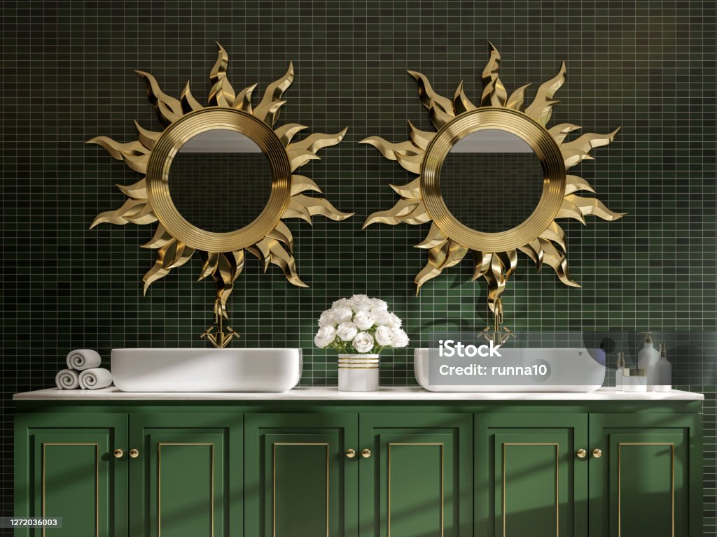 Modern classical style bathroom with green and gold 3d render Modern classical style bathroom 3d render,The room has green mosaic walls tile and green wood cabinets with white marble top decorate with golden sun shape mirror frames. Bathroom Stock Photo