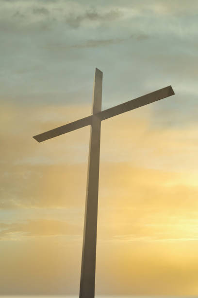 istock Christian Cross Silhouette at Sunset 1272036974
