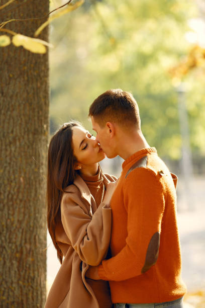 istock Beautiful couple spend time in a autumn field 1272039288