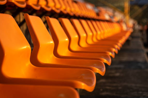 istock Stadium seats on orange color. 1272041993