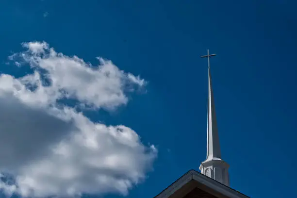 Steeple of a church with some clouds