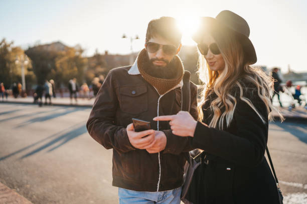 istock Consulting smartphone to explore the city 1272056353