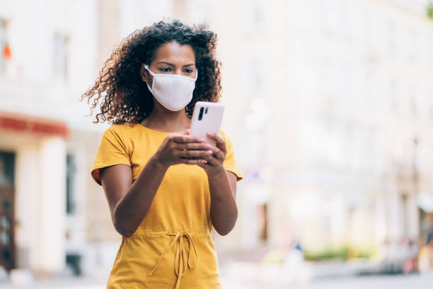 istock Woman with face protective mask 1272057500