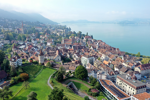 Zug panoramic view over the medieval old town and the beautiful Lake Zug. The wide angle image was captured during summer season.