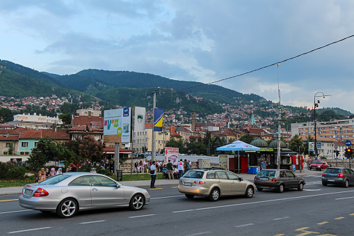 Sarajevo, Bosnia and Herzegovina - July 3rd 2018: A view across Obala Kulina bana to the Bistrick neighbourhood in the evening in Sarajevo, Bosnia