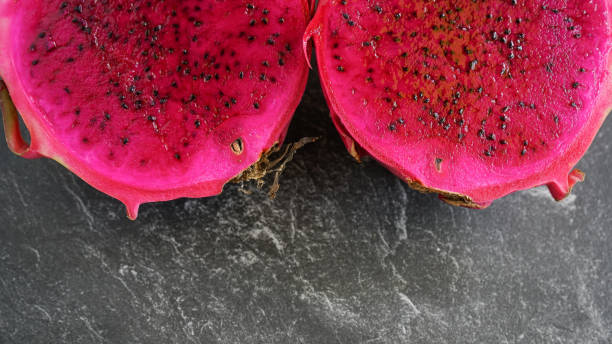 istock two slice of red dragon fruit, served on a stone pad 1272064794