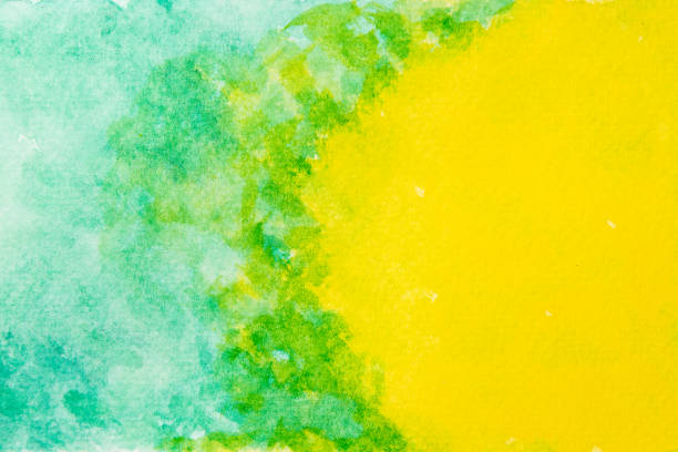 Abstract hand painted green and yellow watercolor background.