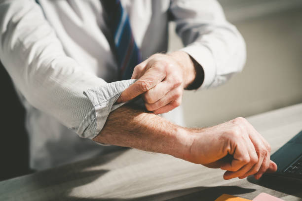 Businessman rolling up his sleeves