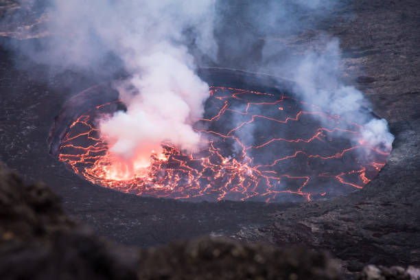 Beautifully structured lava lake inside active Nyiragongo volcano emitting smoke
