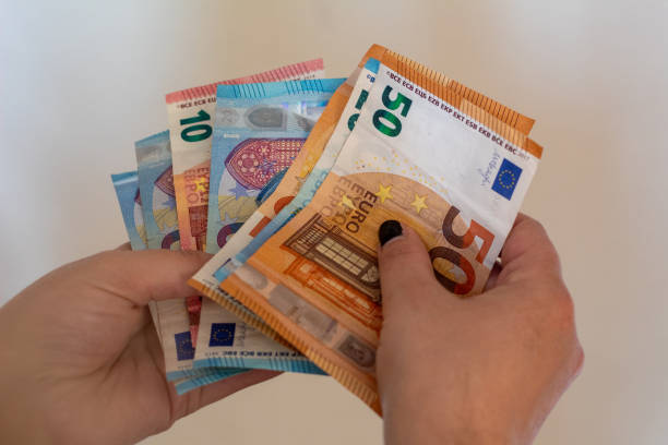 istock Woman hands counting money. 1272069147