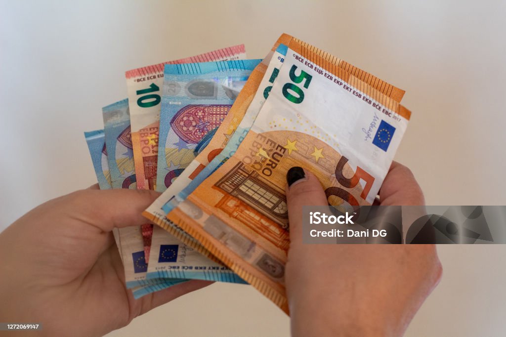 Woman hands counting money. Woman hands counting money, with black nails and copy space. Assistance Stock Photo