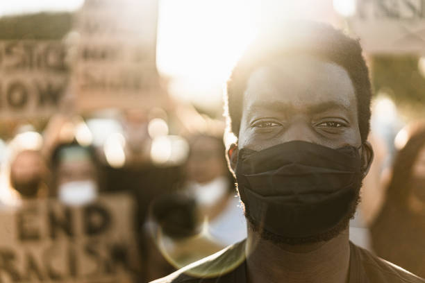 istock Young Black Male Protestor Wearing Protective Face Mask 1272073611
