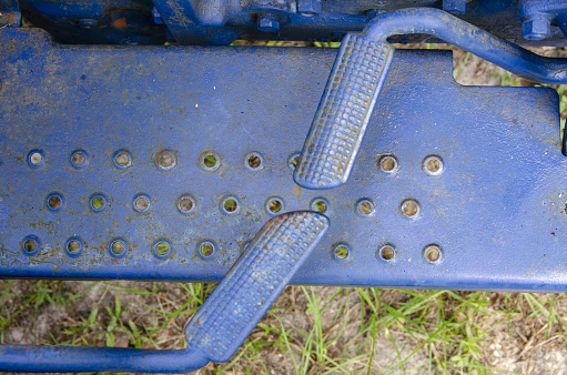 Tractor painted blue. Photo taken in High Springs, Florida with Nikon D7000 with Nikon 28-80 lens