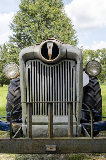 Tractor front with homemade brush guard and missing central light. Photo taken in High Springs, Florida with Nikon D7000 with Nikon 28-80 lens