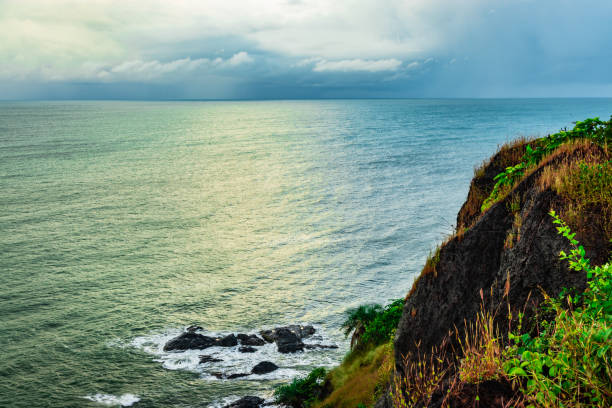 mountain cliff view with sea shore at the morning image is taken at gokarna karnataka india.