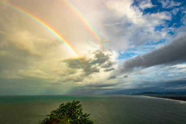 istock rainbow colorful above sea horizon at dawn 1272077565