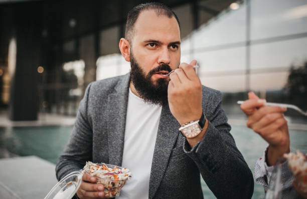 istock Happy business people enjoying their lunch break 1272079508