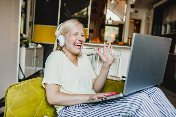 istock A young woman is using laptop at home and communicate via video call 1272082958
