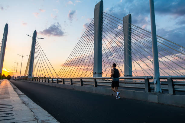 istock A young man running on the bridge 1272086509