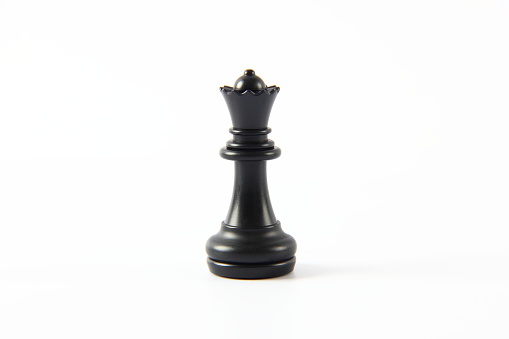 Black queen chess piece on white background