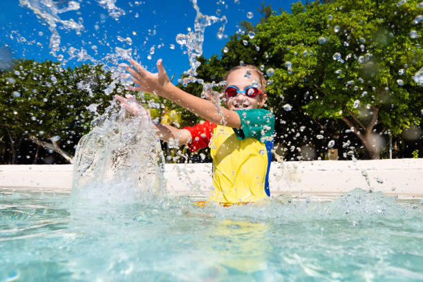 istock Kids playing on beach. Children play at sea. 1272089800