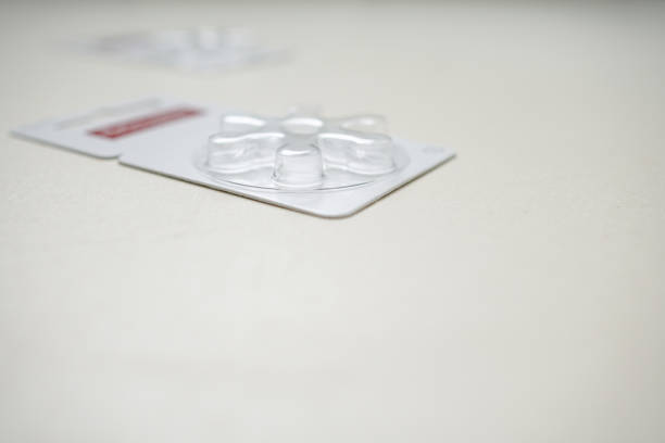 istock Button battery for hearing aids. The battery is exhausted and the transparent plastic box is empty. The object is on the left. 1272090404