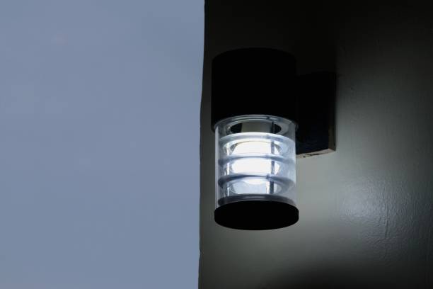 istock close up wall light lamp that turn on in the evening 1272091105