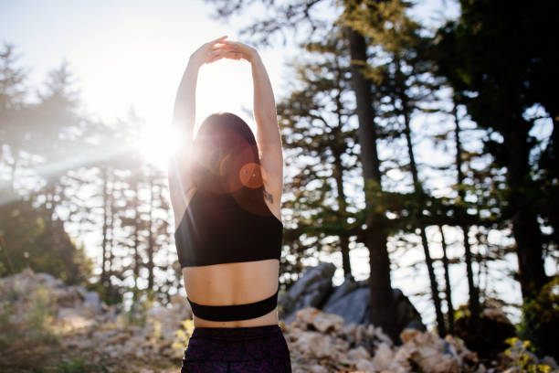 istock Young woman stretching body after jogging 1272091433
