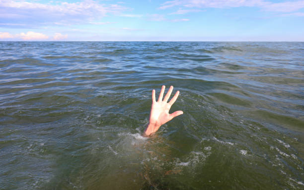 istock hand of the person asking for help while drowning in the sea 1272092554