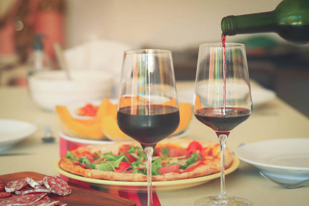 istock red wine glasses on table with food 1272092855