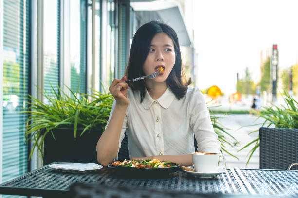 istock Businesswoman eating lunch after work 1272099553