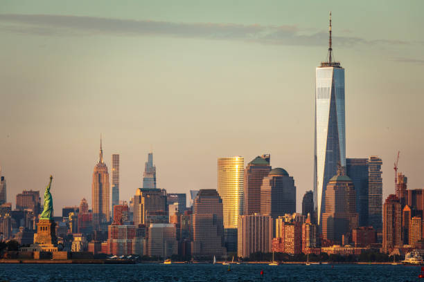 Lower Manhattan and Statue of Liberty The Statue of Liberty from the 9/11 Teardrop Memorial to the struggle against world terrorism statue photos stock pictures, royalty-free photos & images