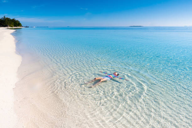 istock Kids playing on beach. Children play at sea. 1272105018