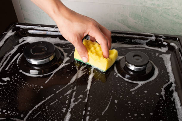 istock cleaning the gas stove with soapy water 1272105101