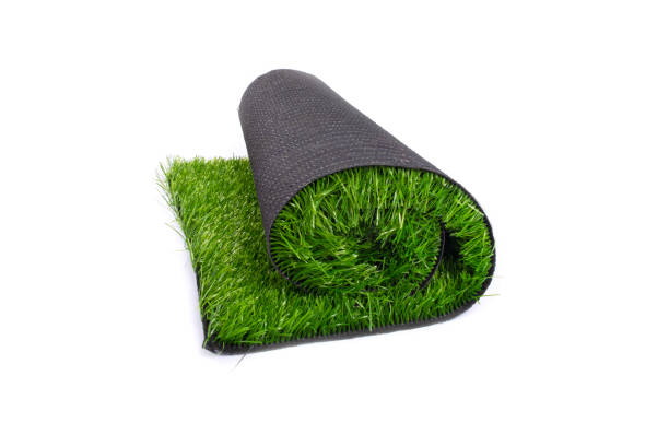 istock roll of artificial green grass, carpet, artificial turf isolated on white background 1272105129