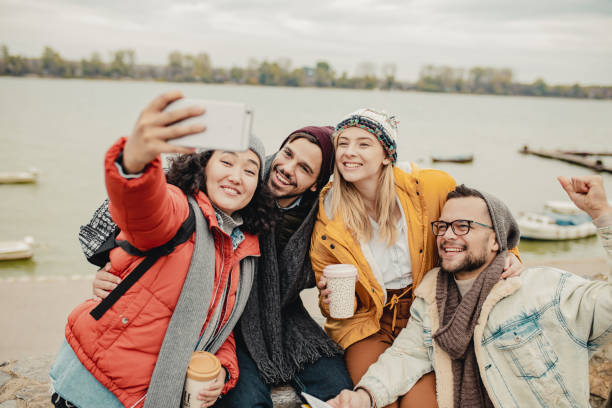 istock Group of friends taking a selfie by the river 1272105152