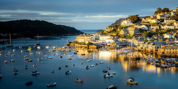 Sunrise over the town of Salcombe, Devon Uk Sunrise at Salconbe Devon, taken from Snape's Point hill. devon photos stock pictures, royalty-free photos & images