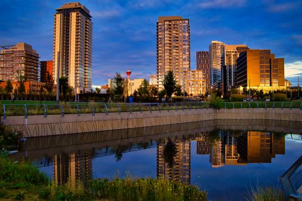 istock Downtown Calgary Buildings Reflecting Into A Park Lake 1272114597
