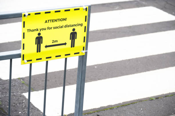 social distancing sign at school playground road crossing - letter m fotos imagens e fotografias de stock