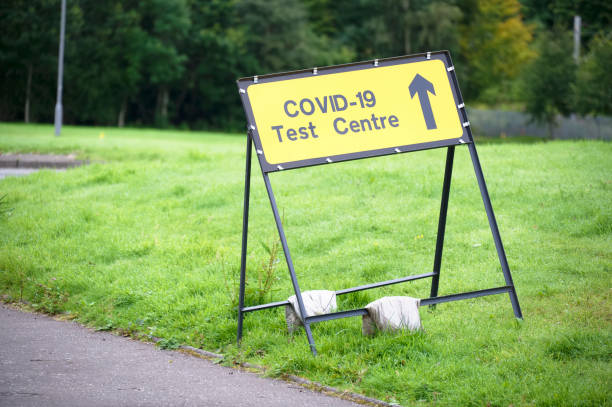 istock Covid-19 test centre sign at road with traffic cones 1272115788