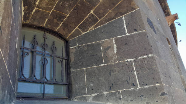 istock A window with bars on the Old castle from the outside. 1272115985