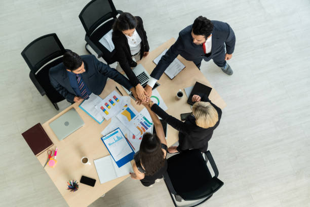istock Happy business people celebrate teamwork success 1272116782
