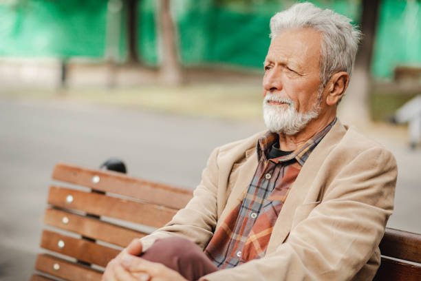 istock Lonely senior man in park 1272118114