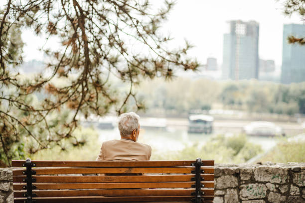 istock Lonely senior woman in park 1272118196