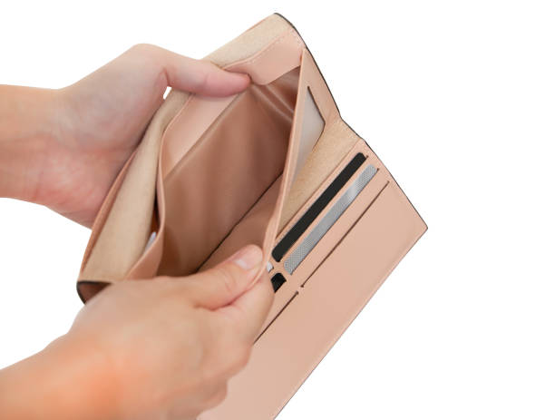 istock Closeup of hands open empty purse isolated on white background with clipping path. 1272119286