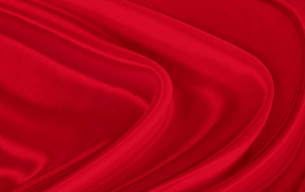 istock Black red satin dark fabric texture luxurious shiny that is abstract silk cloth background with patterns soft waves blur beautiful. 1272120521