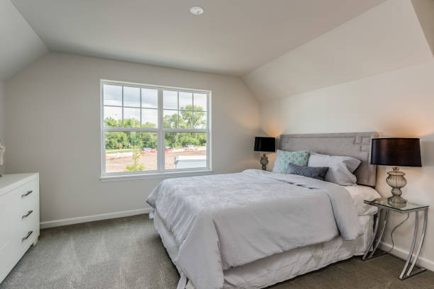 istock Comfy duvet on queen bed in modern bedroom 1272128525