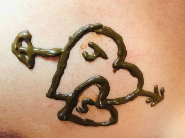 istock Heart making by mehndi on human skin 1272130459