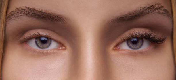 istock Eyelash Extension Procedure. Woman Eye with Long Eyelashes. Close up, selective focus 1272130727