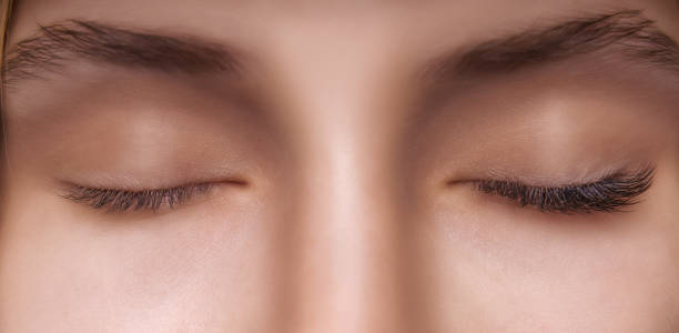 istock Eyelash Extension Procedure. Woman Eye with Long Eyelashes. Close up, selective focus 1272130836